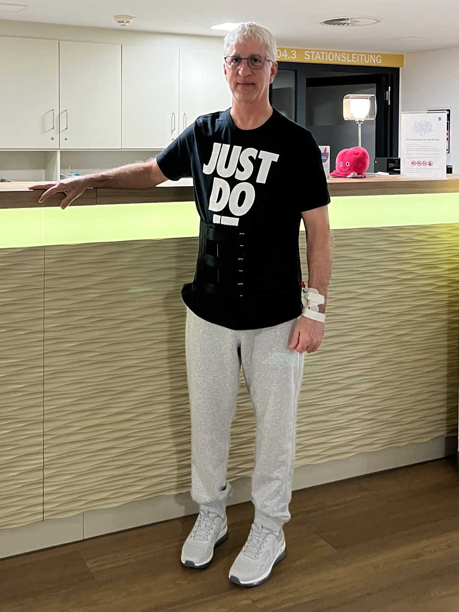 Dale standing in the hospital ward in Cologne after surgery